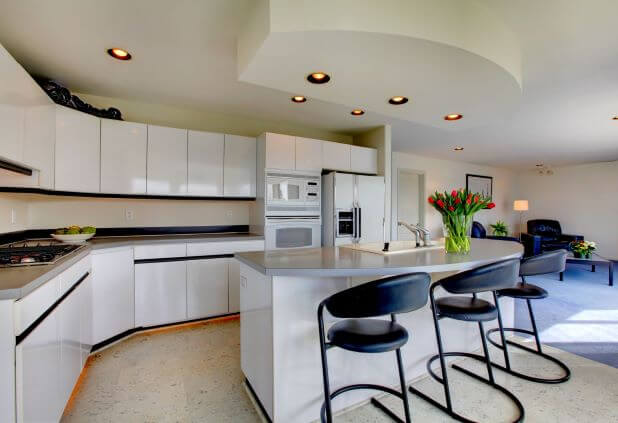 black and white backsplash with white glossy cabinets